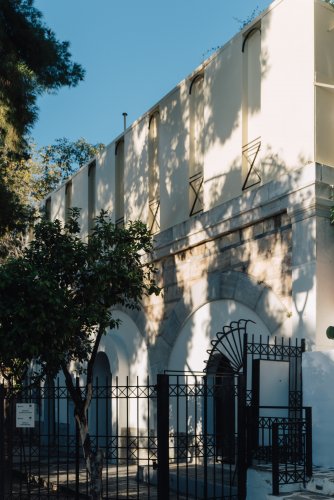 A discreet white 19th-century building in Dexameni Square marks the entrance to Hadrian’s ancient water system. | Photo: Thomas Gravanis