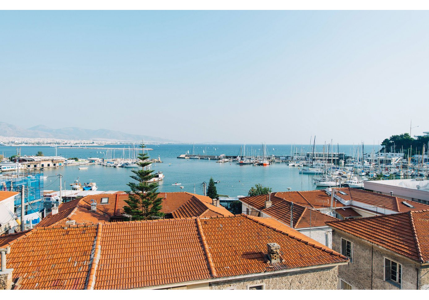 View of Mikrolimano in Piraeus, Athens, over rooftops.