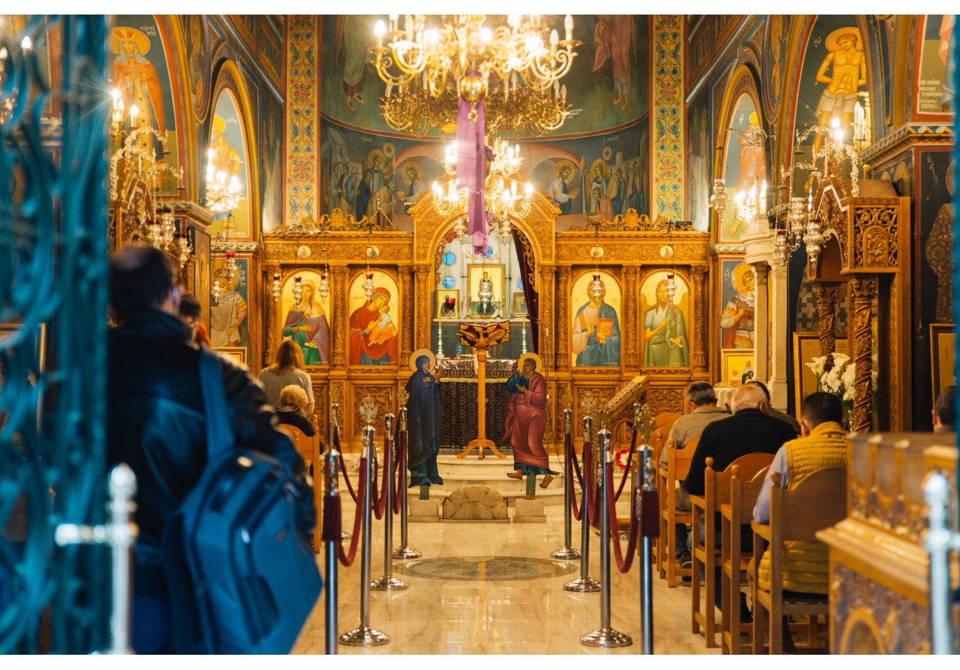 the congregation at the inside of a fully decorated church