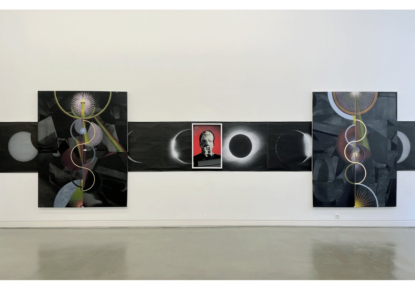 a view of an installation with multiple canvases.