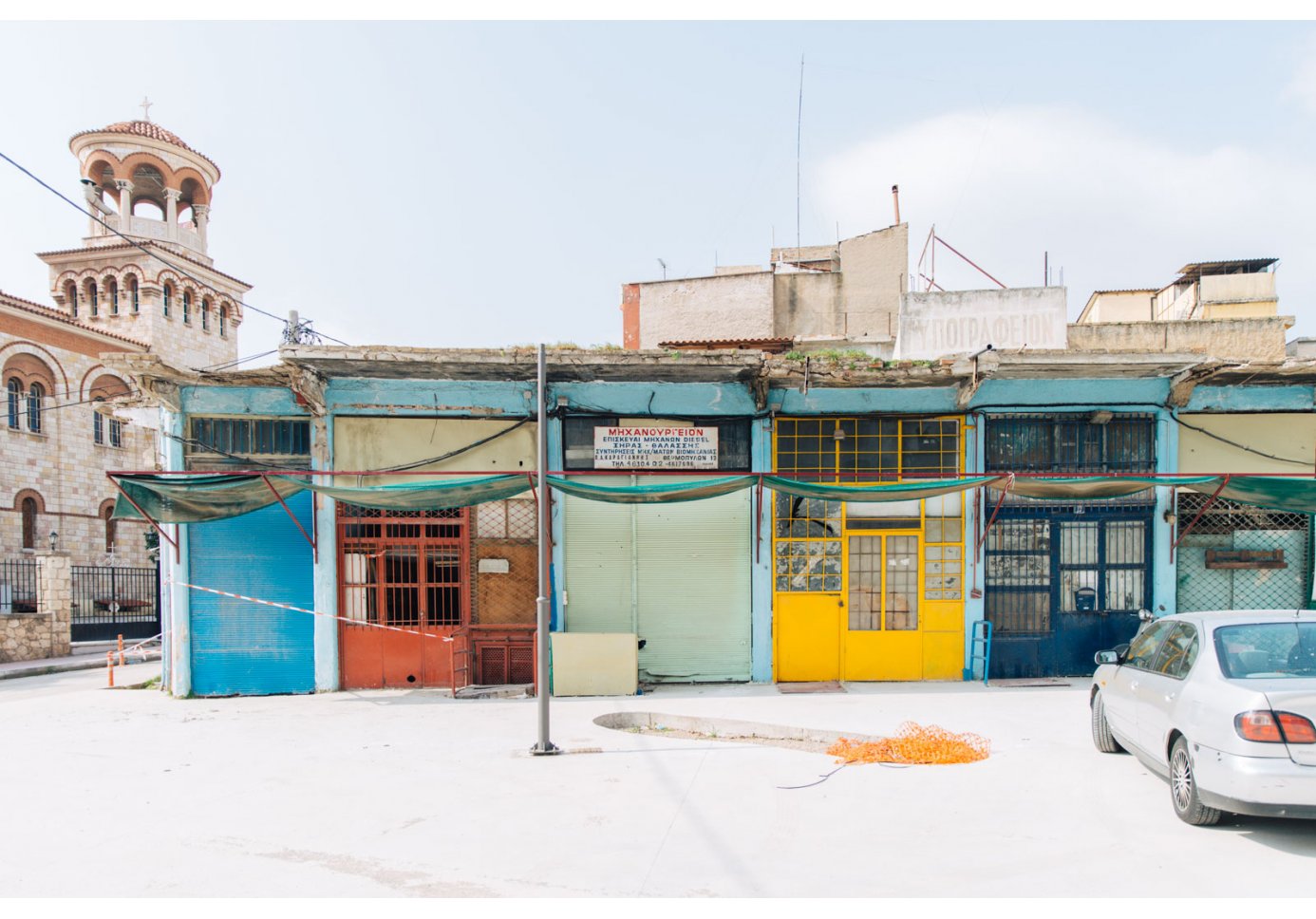 facades of old mechanical shops in Piraeus
