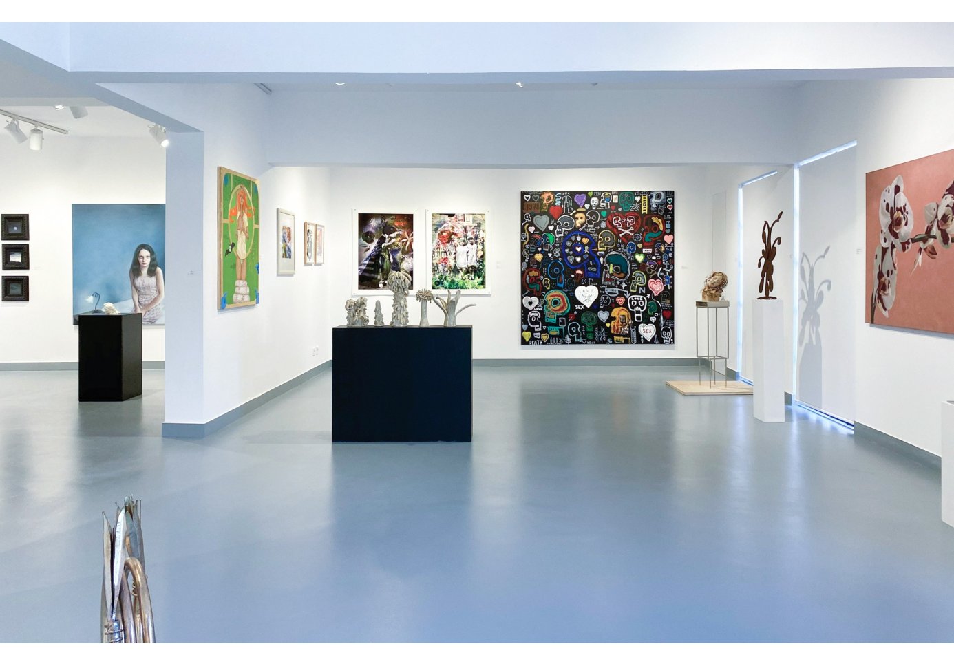 a view of the gallery's inside, artworks around.