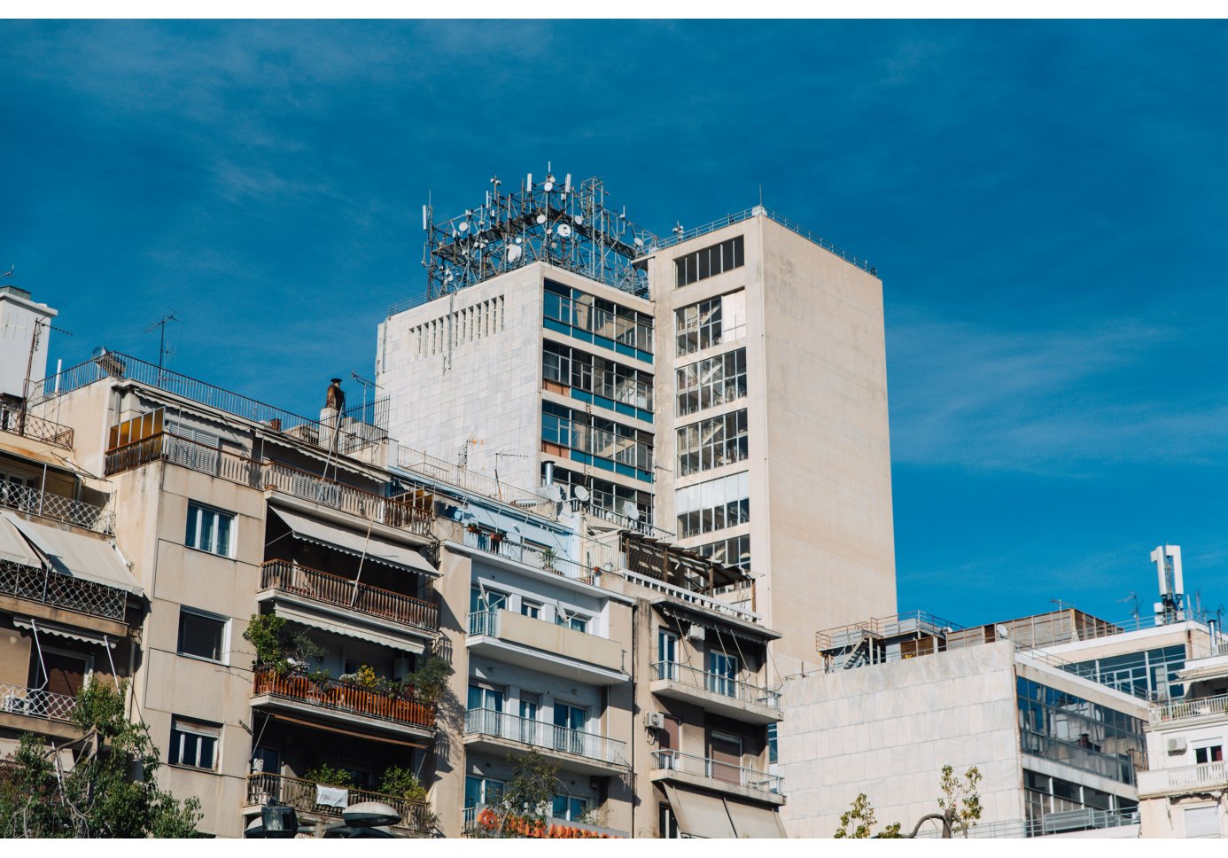 a tower-shaped building among blocks of flats.