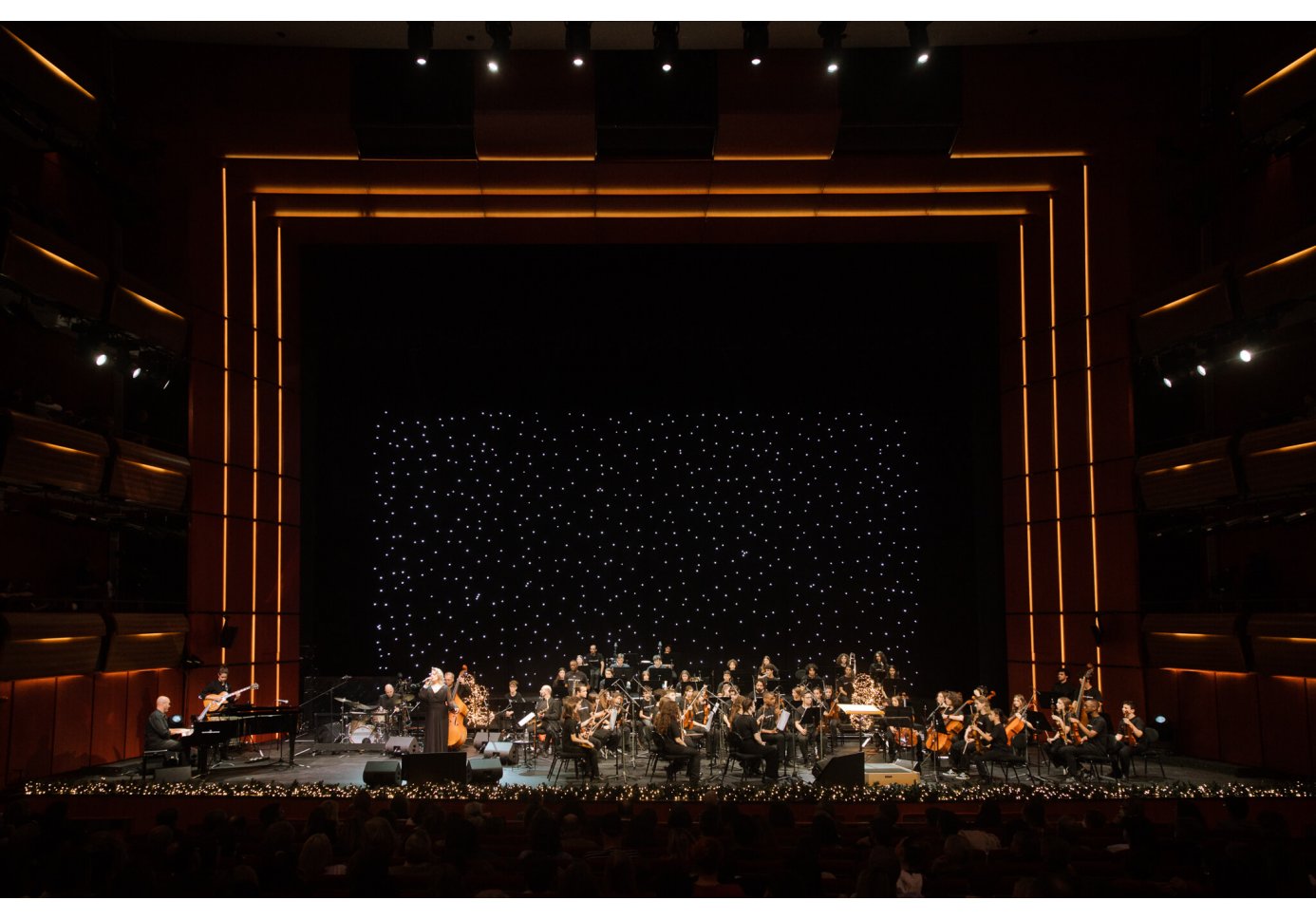 an orchestra performing on a stage